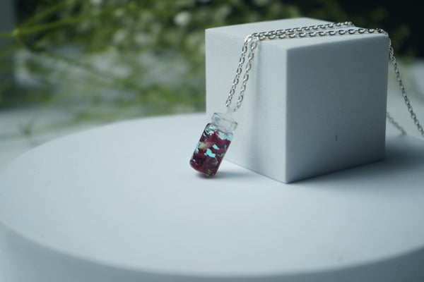Rose pettle in small bottle pendent