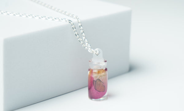 Butterfly Rose pettle in small bottle pendent