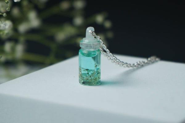 White Annes lace real flower in small bottle pendent